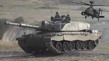 Challenger 2 battle tanks, Apache attack helicopters, and pickup trucks with guns 🪖